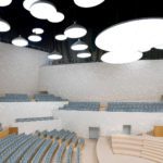 The sphere fragment walls of the Concert Hall are clad with white custom designed ceramic tiles. The ceramic tile are combined with solid bamboo material. The ceiling reflectors “Light Cloud” consist of back-lid acrylic surfaces.