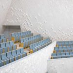 The pattern of the ceramic tiles in the Concert Hall is a result of a complex acoustic script, developed to define the exact location of smooth/ reflective surfaces compared to rough/ diffuse surfaces.