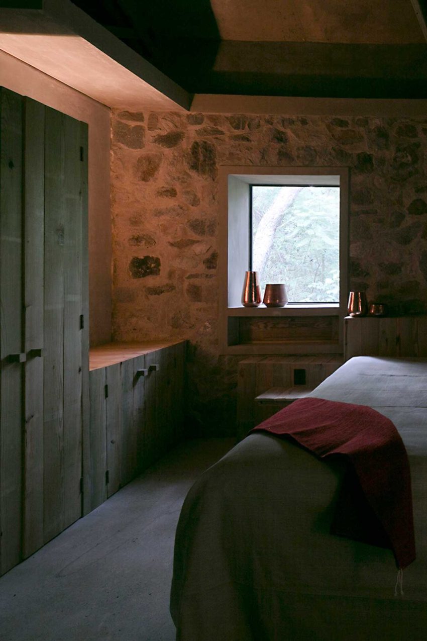 Stone walls in modern rural house in bedroom space