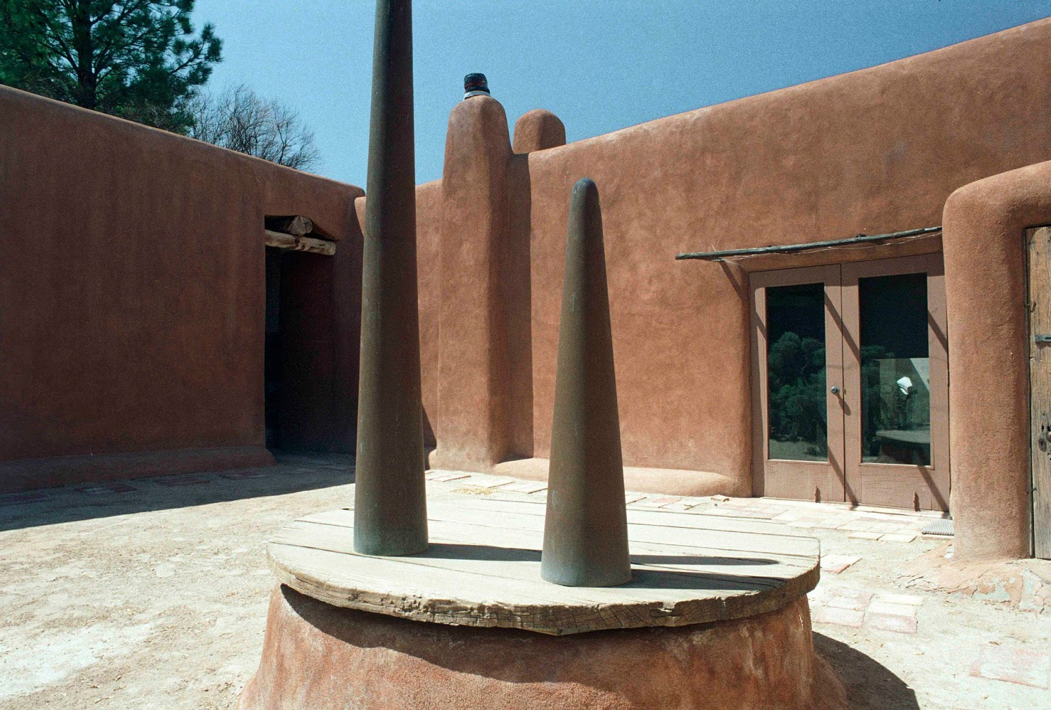 Georgia O Keeffe Home and Studio ArchEyes bronze sculptures on well