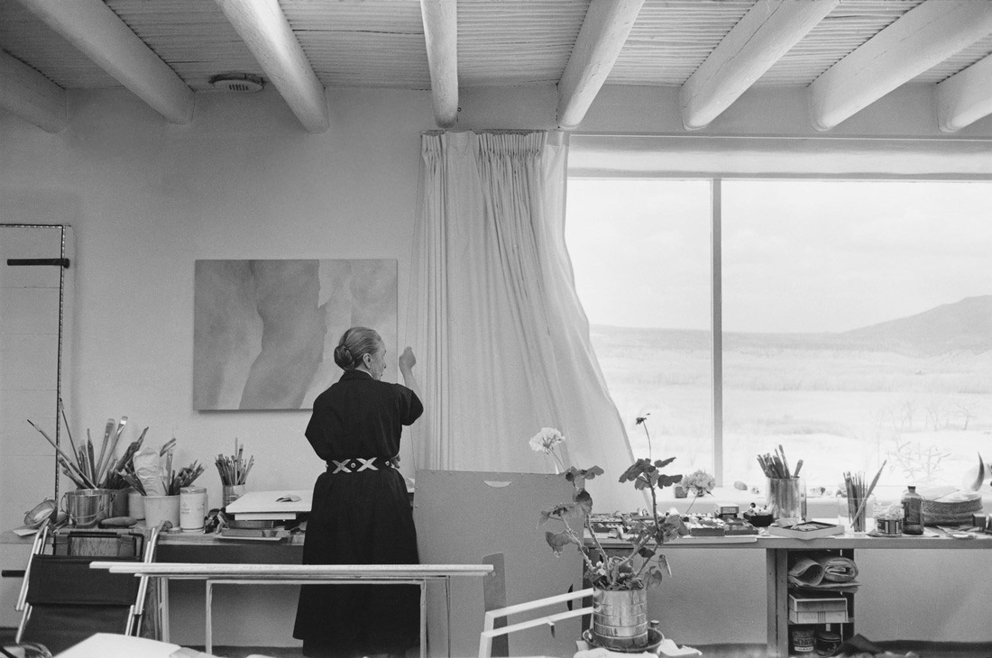 Georgia O Keeffe Home and Studio ArchEyes opening the curtains of her studio gelatin silver