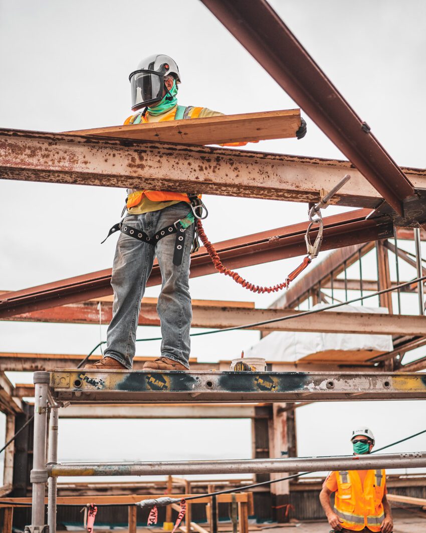 Construction Worker installing metal beams -  Design your House 