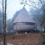 The Mushroom by ZJJZ is a cone-shaped guest house in the woods of