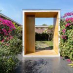 Entry to the private cottages framed by Bougainvillea
