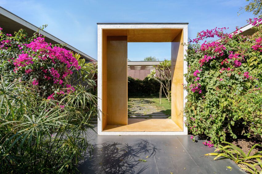 Entry to the private cottages framed by Bougainvillea