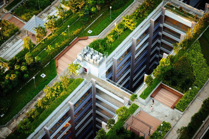 An apartment complex with a garden on top serving as a representation of how sustainable architecture is changing the face of real estate development
