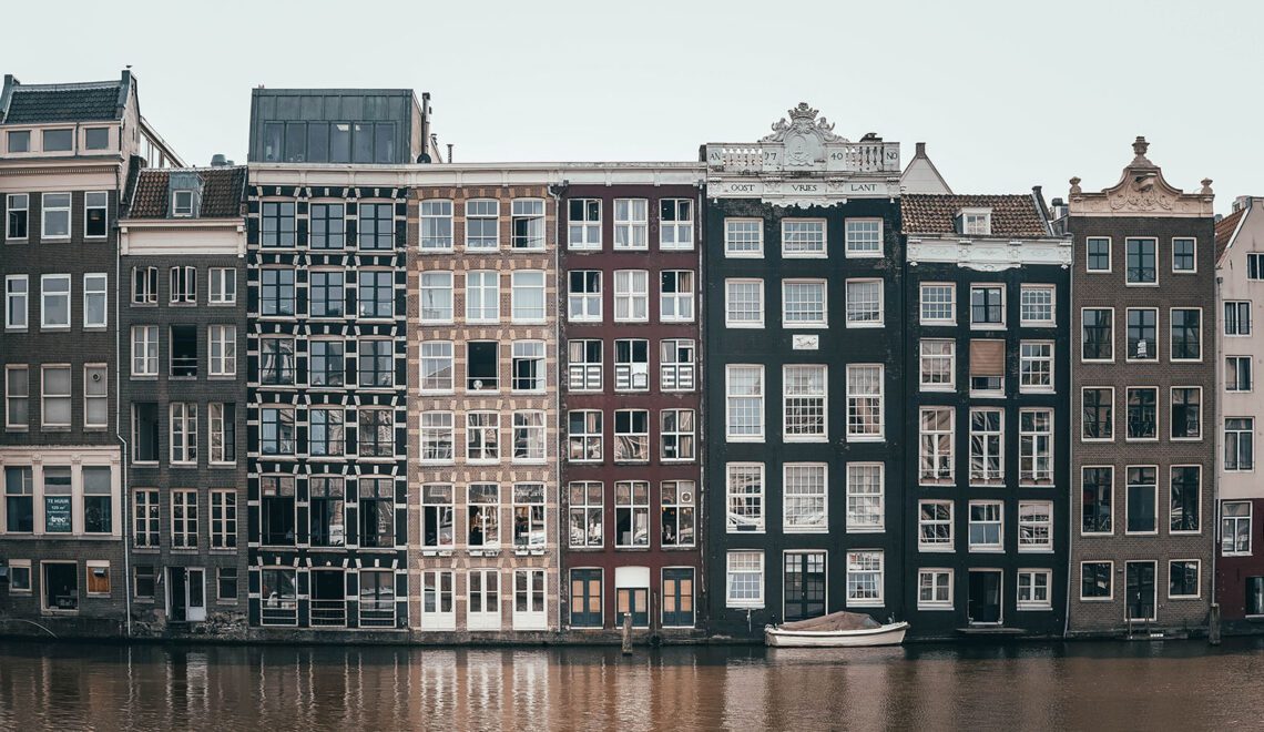 Building Facade in Canal in Holand. Photograph by Ian Valerio