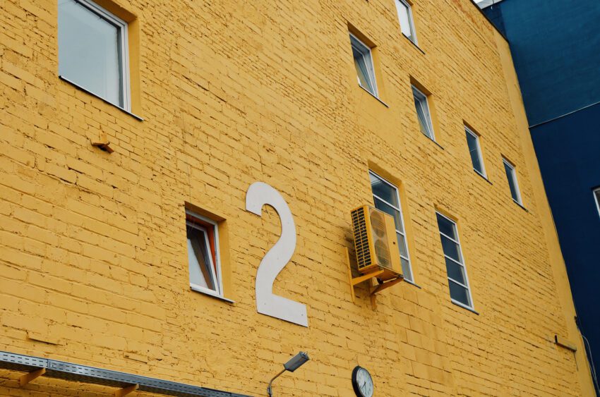 Yellow facade and HVAC - Air conditioner. Photograph by natasha polyakova