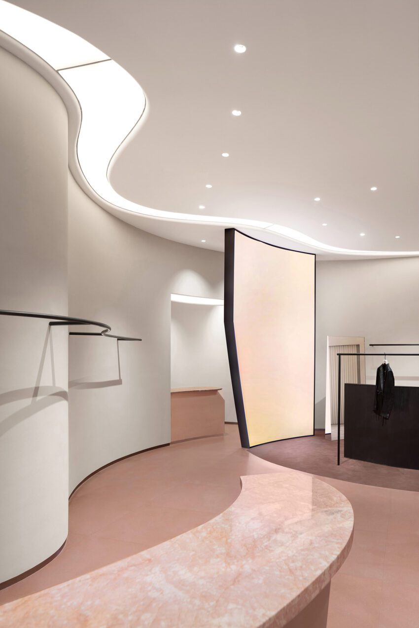Curved countertops and hanging rods connect viewpoints The New Brand Space of JASON WU by SLT Design Vincent Wu