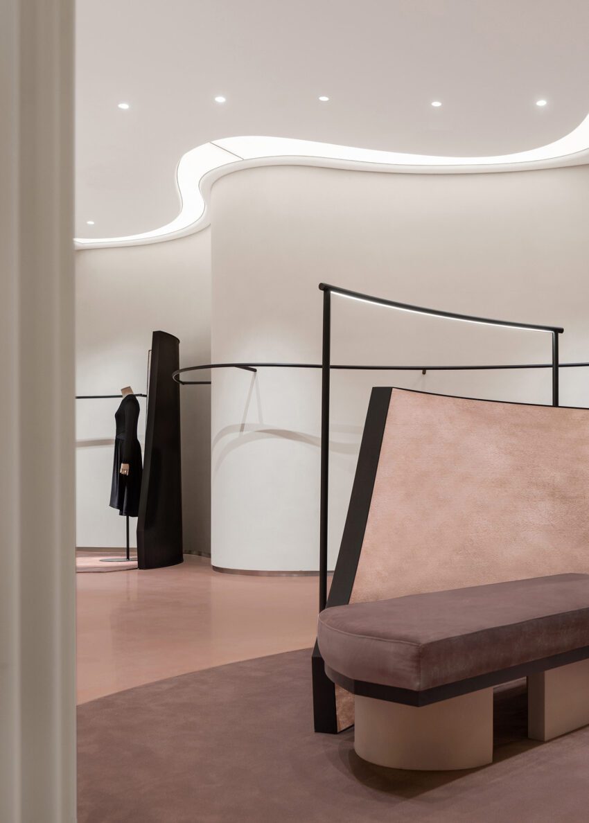 Curved countertops and hanging rods connect viewpoints The New Brand Space of JASON WU by SLT Design Vincent Wu